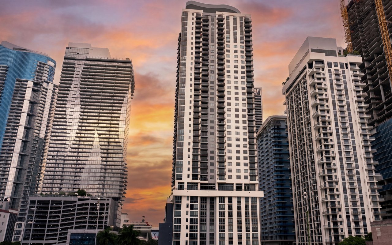 Brickell-area residential towers at sunset — high-rise curtainwall and window wall construction in South Florida HVHZ